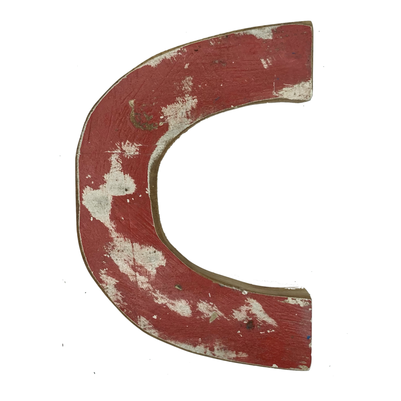 Wooden letter C made out of old fishing boats