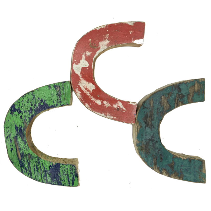 Wooden letter C made out of old fishing boats