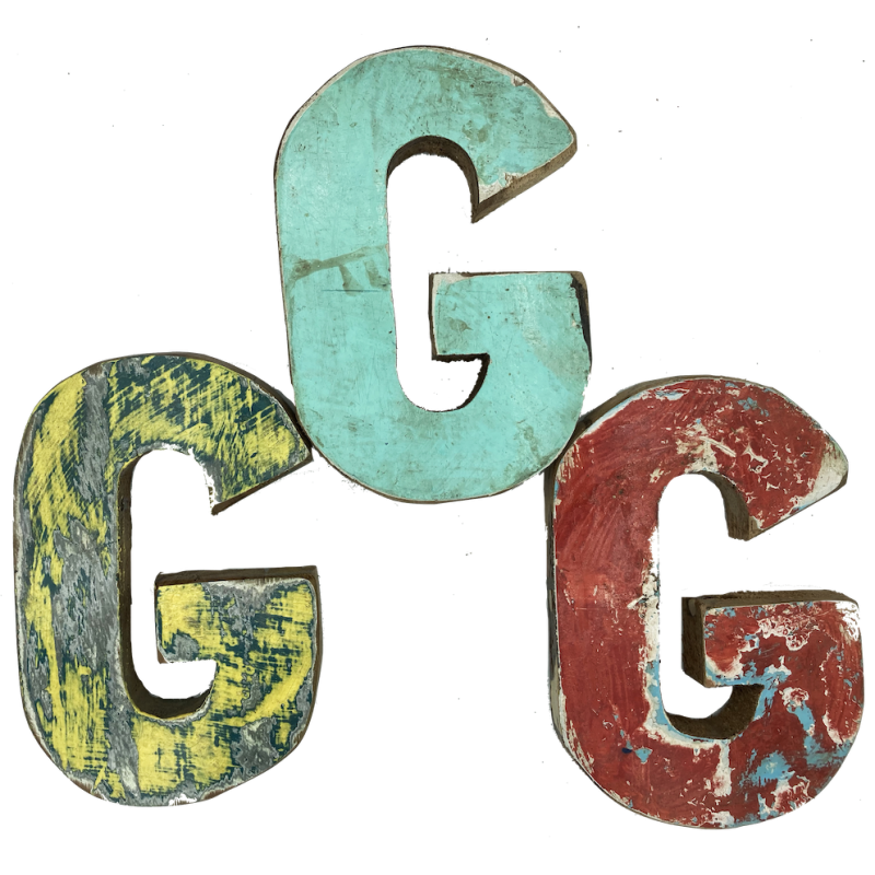 Wooden letter G made out of old fishing boats