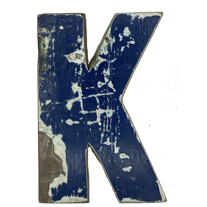 Wooden letter K made out of old fishing boats