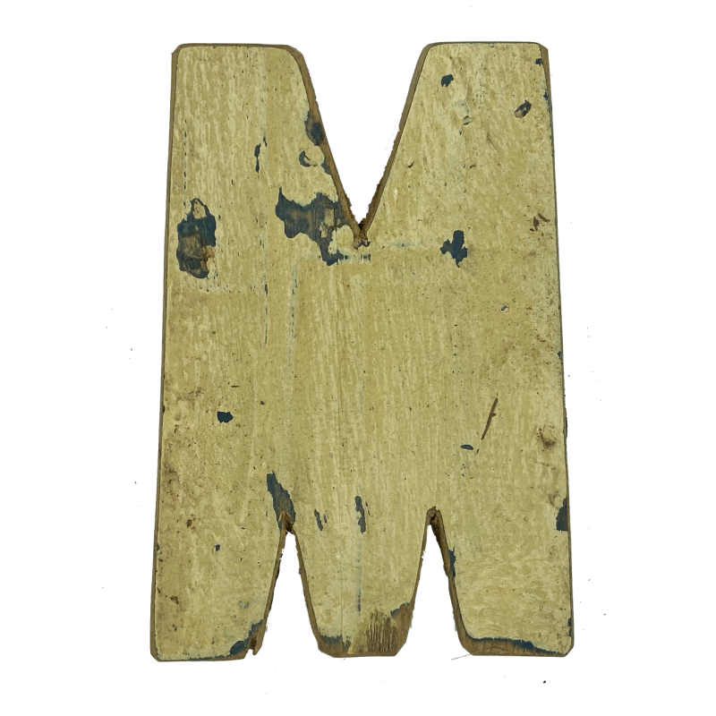 Wooden letter M made out of old fishing boats