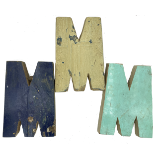 Wooden letter M made out of old fishing boats