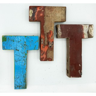 Wooden letter T made out of old fishing boats