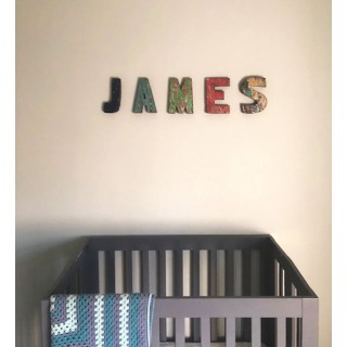 Wooden letter R made out of old fishing boat