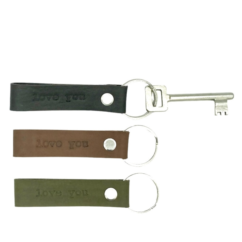 A leather key chain |A leather key chain with text LOVE YOU